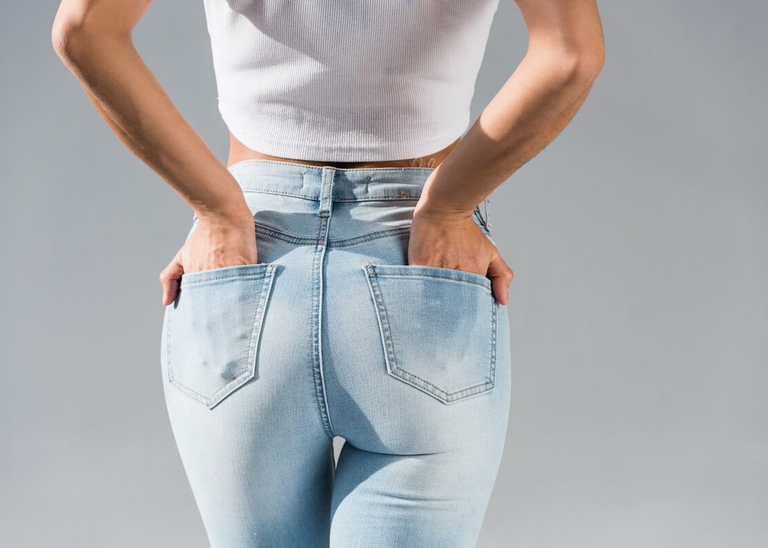 woman in jeans with hands in p